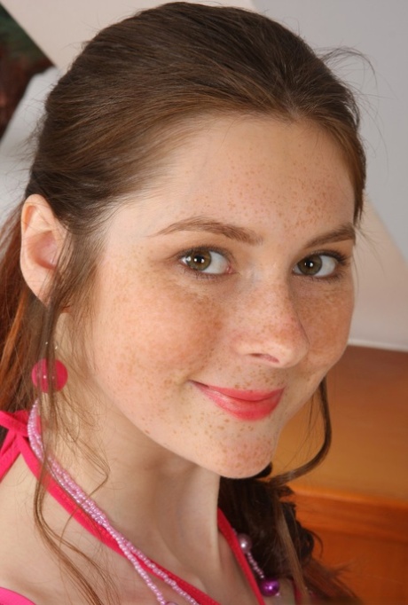 Young cutie is proud of her pink thong panties and her hairy muff