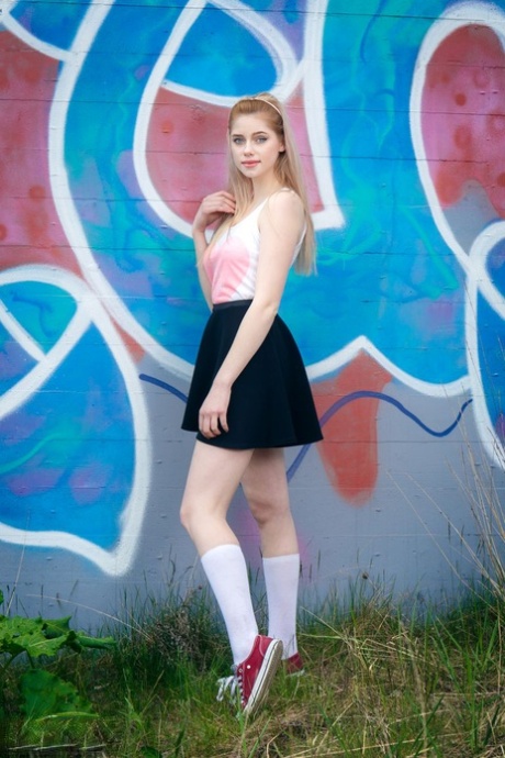 Fair skinned amateur Margarita shows her tits and twat in front of graffiti