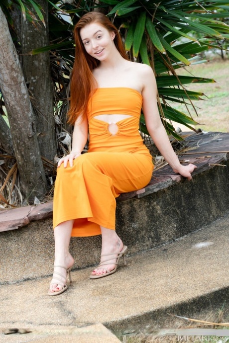 Redheaded teen Mary Fox gets naked in heels near a swimming pool