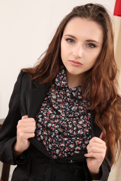 Brunette teen Sophia Blake doffs her uniform and unveils her titties