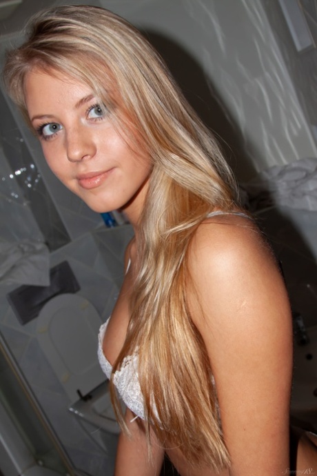 Sexy blonde teen with blue eyes Barbara D shows her big tits and ass